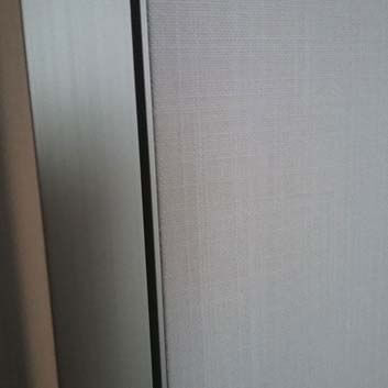 Close up of upholstered doors with metal side