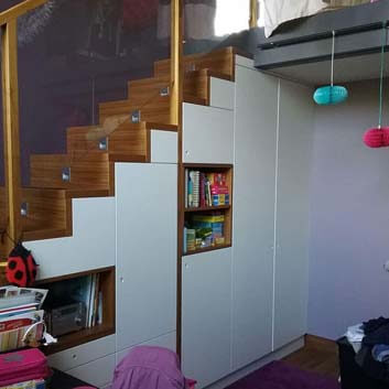 Multifunctional children's room storage and staircase solution