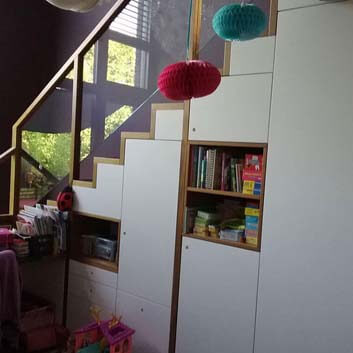 Multifunctional children's room storage and staircase solution